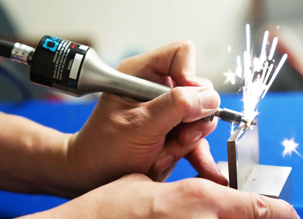 A 201SV pencil grinder deburring a titanium part.